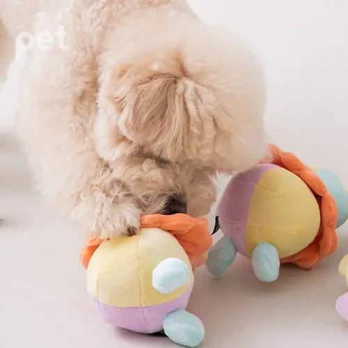 Dog playing with BITE ME Long-Lasting Nosework Clown Toy with treat pockets and squeaker